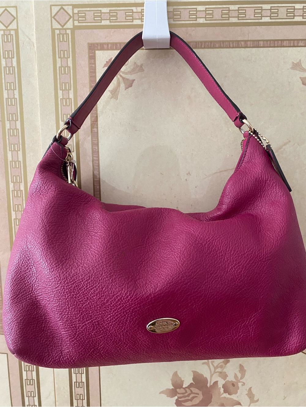 Coach Pebbled Leather Hobo Bag in Fuchsia with cross body strap